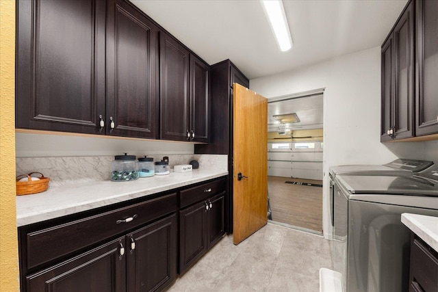 406 N Northridge Way, Fairfield, WA 99012 - laundry room featuring washing machine and clothes dryer, cabinet space, and light tile patterned floors
