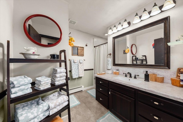 406 N Northridge Way, Fairfield, WA 99012 - full bathroom featuring a baseboard heating unit, vanity, curtained shower, visible vents, and tile patterned floors