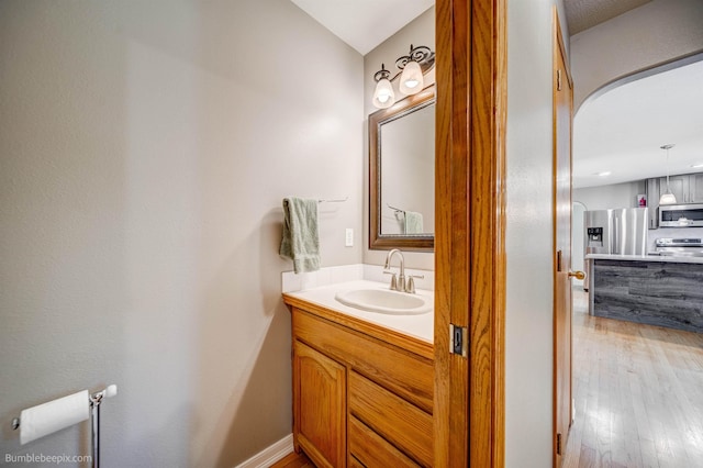 2712 W Eden Ln, Deer Park, WA 99006 - bathroom featuring wood finished floors and vanity
