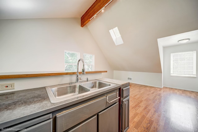 2712 W Eden Ln, Deer Park, WA 99006 - kitchen with a sink, rail lighting, dishwasher, light wood finished floors, and lofted ceiling with skylight