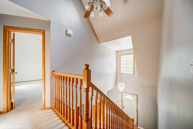 2712 W Eden Ln, Deer Park, WA 99006 - corridor featuring baseboards, an upstairs landing, carpet floors, and high vaulted ceiling
