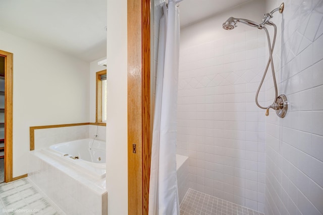 2712 W Eden Ln, Deer Park, WA 99006 - bathroom featuring tile patterned flooring, a jetted tub, and tiled shower