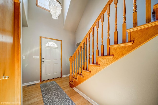 2712 W Eden Ln, Deer Park, WA 99006 - entrance foyer featuring stairs, wood finished floors, a towering ceiling, visible vents, and baseboards