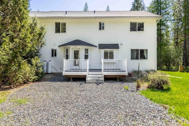 2712 W Eden Ln, Deer Park, WA 99006 - rear view of house with a yard, roof with shingles, and a wooden deck