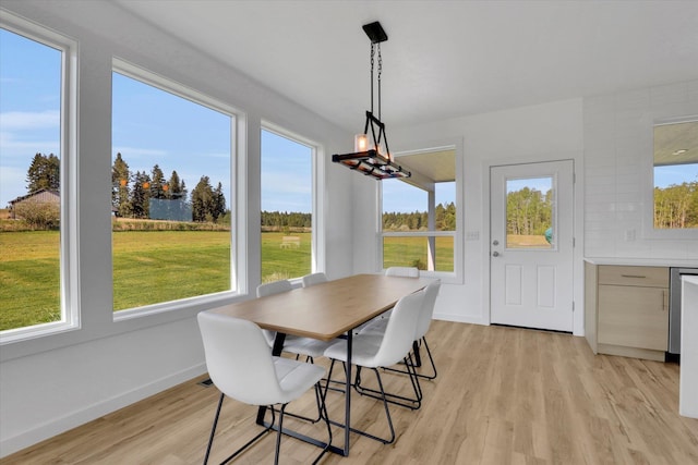 32715 N Elk Chattaroy Rd, Chattaroy, WA 99003 - dining room with light wood finished floors and baseboards