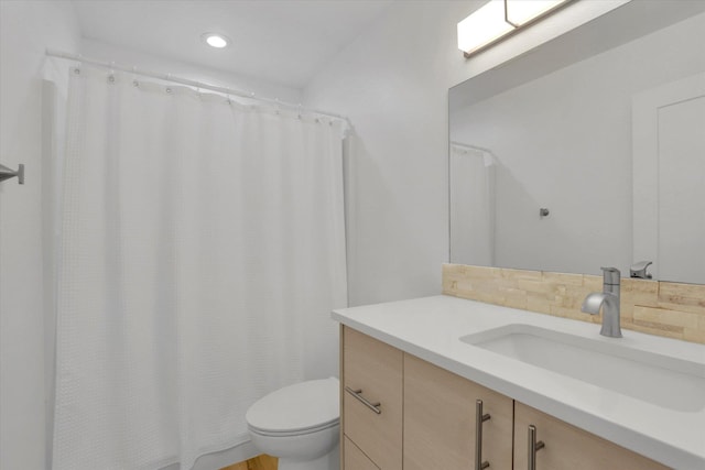 32715 N Elk Chattaroy Rd, Chattaroy, WA 99003 - full bathroom with vanity, toilet, backsplash, recessed lighting, and curtained shower