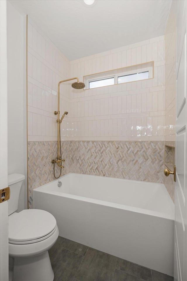 bathroom with toilet and shower / bath combination