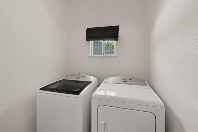 washroom with laundry area and separate washer and dryer