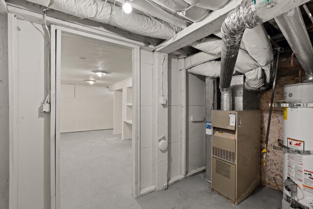 unfinished basement featuring water heater and heating unit