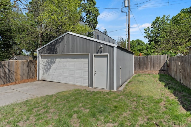 detached garage featuring fence