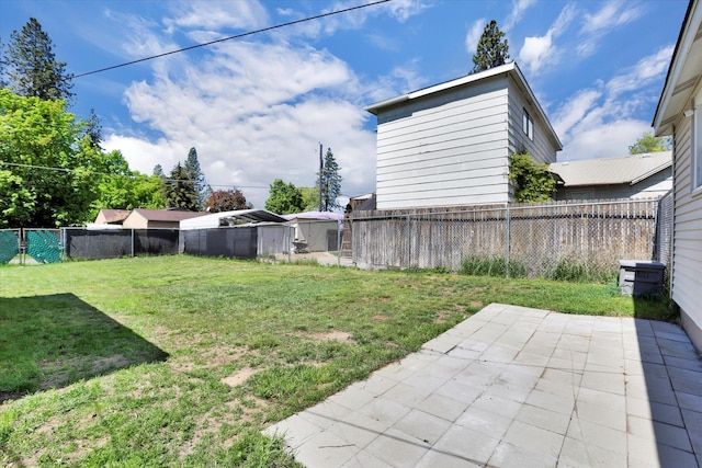 view of yard featuring a patio area and a fenced backyard