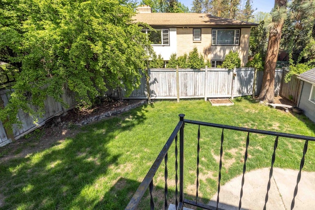 view of yard with a fenced backyard