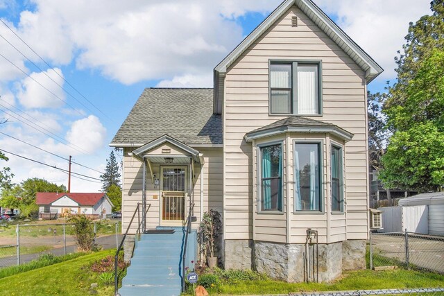 517 S Maple St, Spokane, WA 99204 - view of front of property with roof with shingles and fence