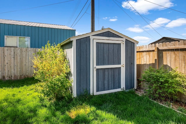 1815 E Longfellow Avenue 1817E. Longfellow Ave, Spokane, WA 99207 - view of shed with a fenced backyard