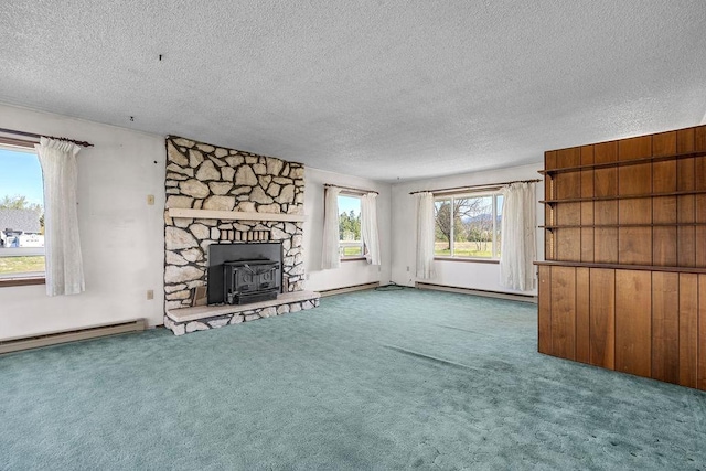 unfurnished living room featuring carpet floors, a baseboard radiator, and a textured ceiling