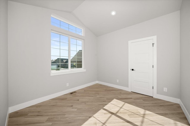 1715 S Lloyd Ln, Spokane, WA 99212 - spare room with vaulted ceiling, wood finished floors, and baseboards