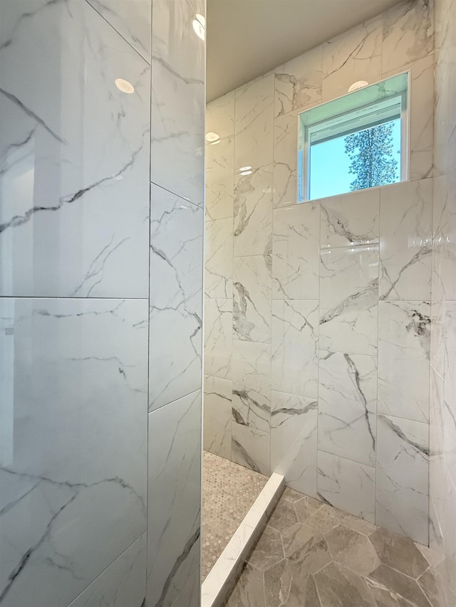 bathroom featuring tiled shower