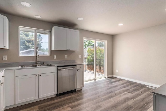 kitchen with a sink, stainless steel dishwasher, recessed lighting, and light wood-style floors