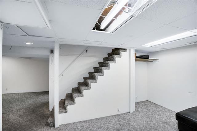 2424 W Fairview Ave, Spokane, WA 99205 - finished basement with carpet, stairs, and a paneled ceiling