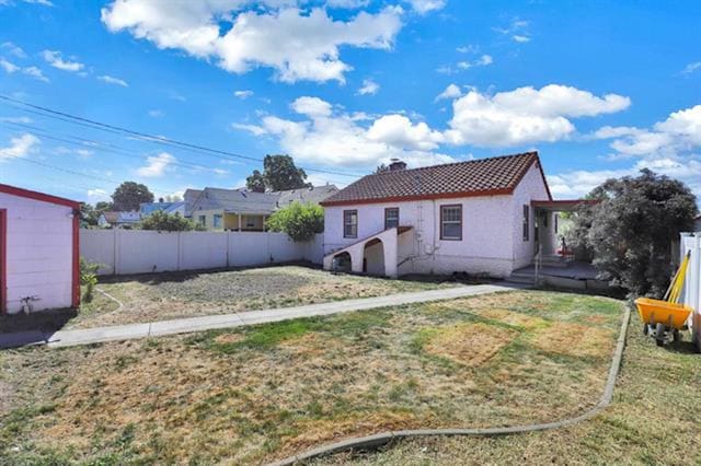 2424 W Fairview Ave, Spokane, WA 99205 - rear view of property with a tiled roof and stucco siding