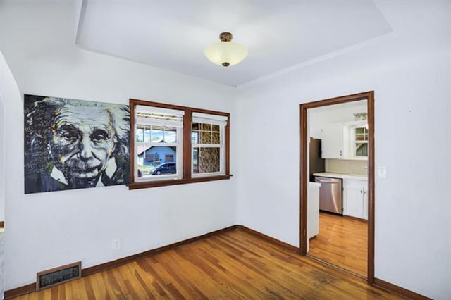 2424 W Fairview Ave, Spokane, WA 99205 - empty room featuring wood finished floors and baseboards