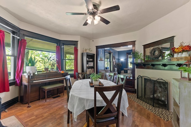 901 W 15th Ave, Spokane, WA 99203 - dining area featuring a ceiling fan, wood finished floors, and a fireplace with flush hearth
