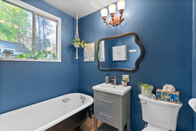901 W 15th Ave, Spokane, WA 99203 - full bathroom featuring toilet, a soaking tub, and vanity