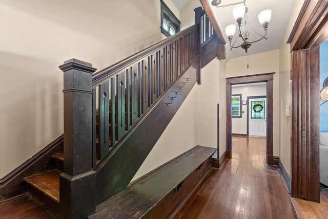901 W 15th Ave, Spokane, WA 99203 - staircase with a chandelier, hardwood / wood-style floors, and baseboards