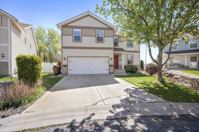 1605 W Kedlin Ln, Spokane, WA 99208 - traditional home with a garage, concrete driveway, and a front lawn