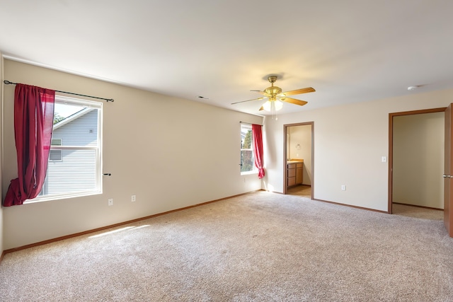 1605 W Kedlin Ln, Spokane, WA 99208 - unfurnished bedroom featuring baseboards, light carpet, and a ceiling fan