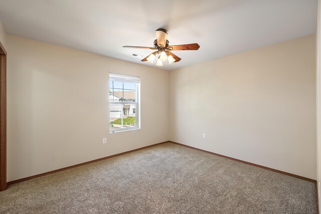 1605 W Kedlin Ln, Spokane, WA 99208 - spare room featuring light colored carpet, a ceiling fan, and baseboards