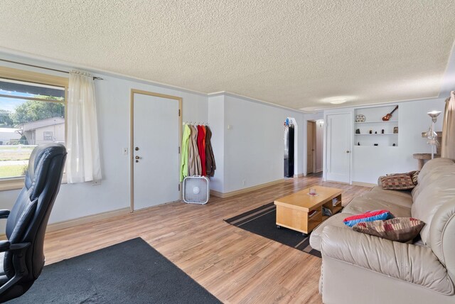 16813 E Valleyway Ave, Spokane Valley, WA 99037 - living area featuring a textured ceiling, wood finished floors, and baseboards