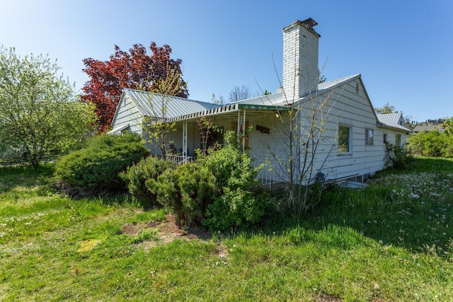 view of side of property with a chimney