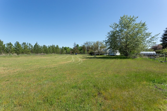 view of yard with a rural view
