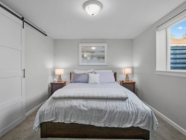 1734 N Stone St, Spokane, WA 99207 - carpeted bedroom featuring baseboards and a barn door