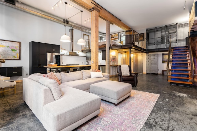 1016 W Railroad Ave Unit 202, Spokane, WA 99201 - living room with a high ceiling and stairway