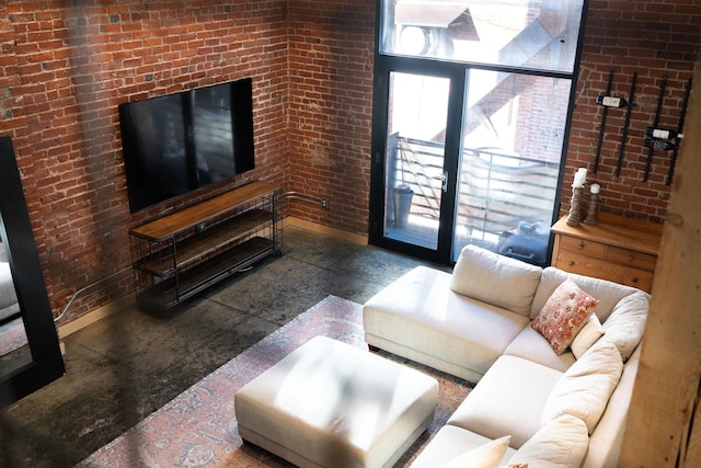 1016 W Railroad Ave Unit 202, Spokane, WA 99201 - living area featuring brick wall and baseboards