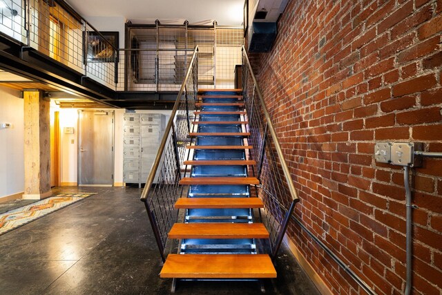 1016 W Railroad Ave Unit 202, Spokane, WA 99201 - stairs with baseboards and a high ceiling