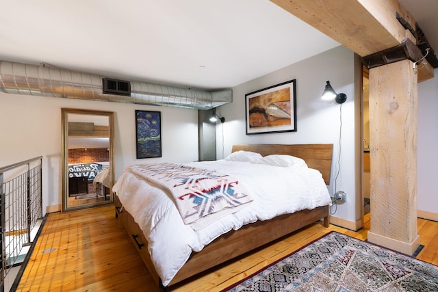 1016 W Railroad Ave Unit 202, Spokane, WA 99201 - bedroom with wood-type flooring and baseboards