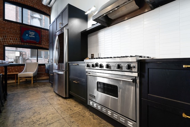 1016 W Railroad Ave Unit 202, Spokane, WA 99201 - kitchen with appliances with stainless steel finishes, wall chimney range hood, and concrete flooring