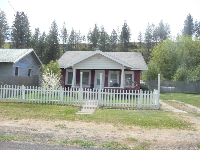 view of front of house with a porch and a fenced front yard