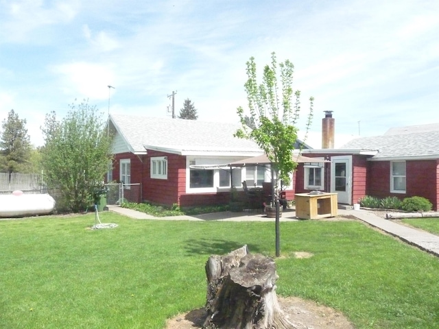 ranch-style home with a chimney