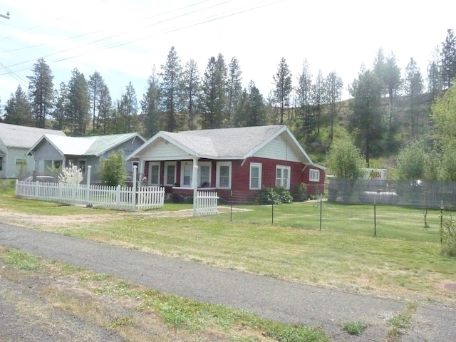 single story home featuring covered porch