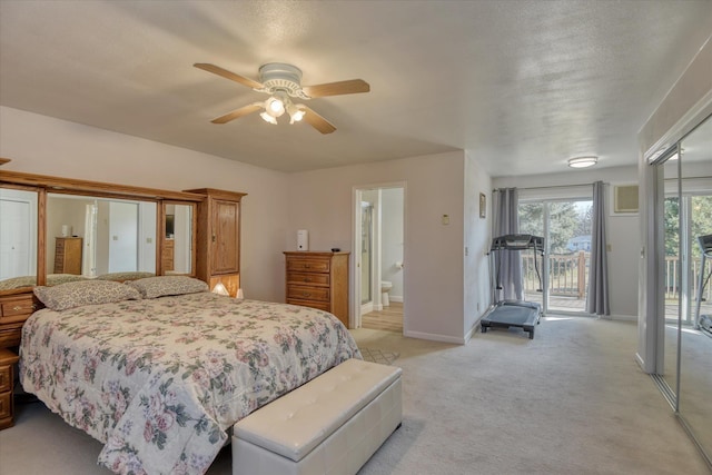 bedroom featuring access to outside, light colored carpet, baseboards, ensuite bathroom, and ceiling fan
