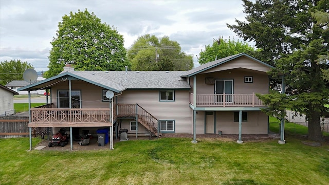 rear view of property featuring a wooden deck, a shingled roof, and stairs