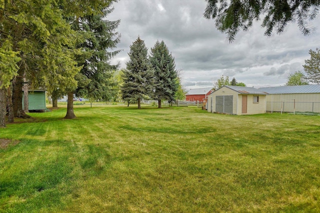 view of yard with an outdoor structure and a storage unit