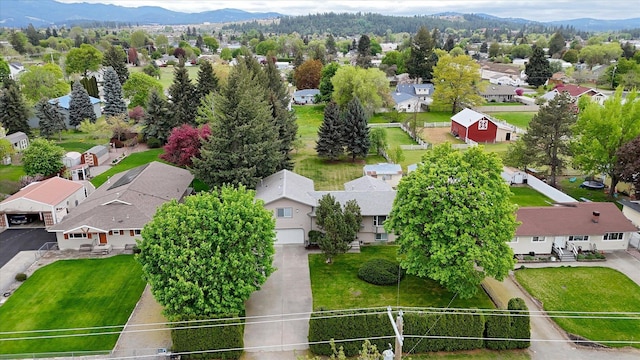 aerial view of residential area featuring mountains