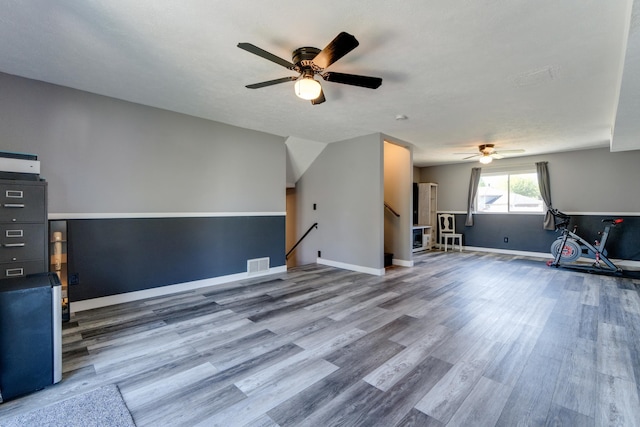 5212 N Bellevue Ct, Spokane Valley, WA 99216 - unfurnished living room with a ceiling fan, wood finished floors, and baseboards