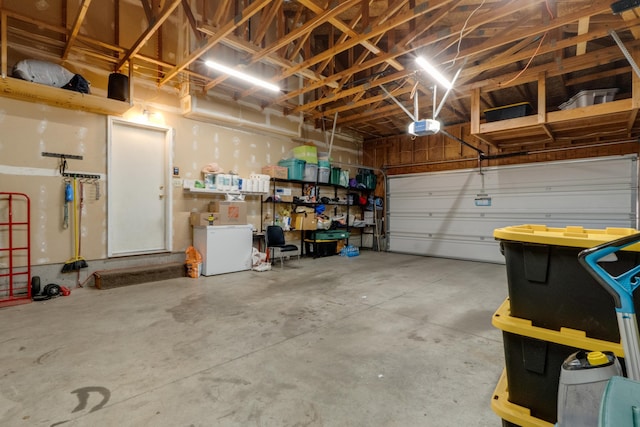 5212 N Bellevue Ct, Spokane Valley, WA 99216 - garage with a garage door opener and fridge