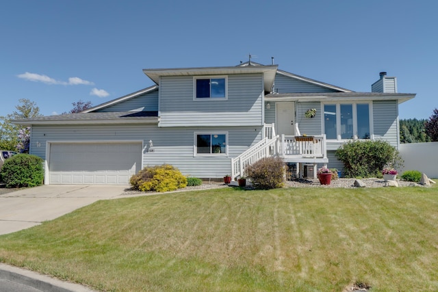 5212 N Bellevue Ct, Spokane Valley, WA 99216 - view of front of house with a garage, a front yard, concrete driveway, a chimney, and stairs
